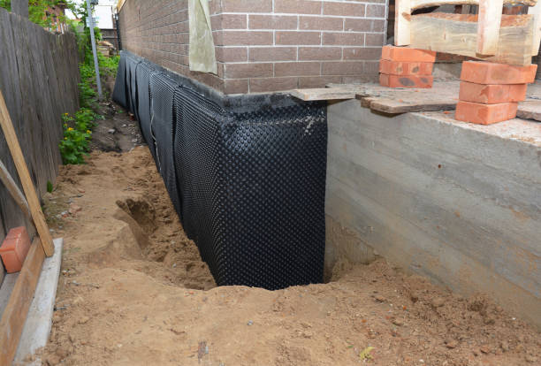 Happy homeowners after waterproofing job in Lumberton